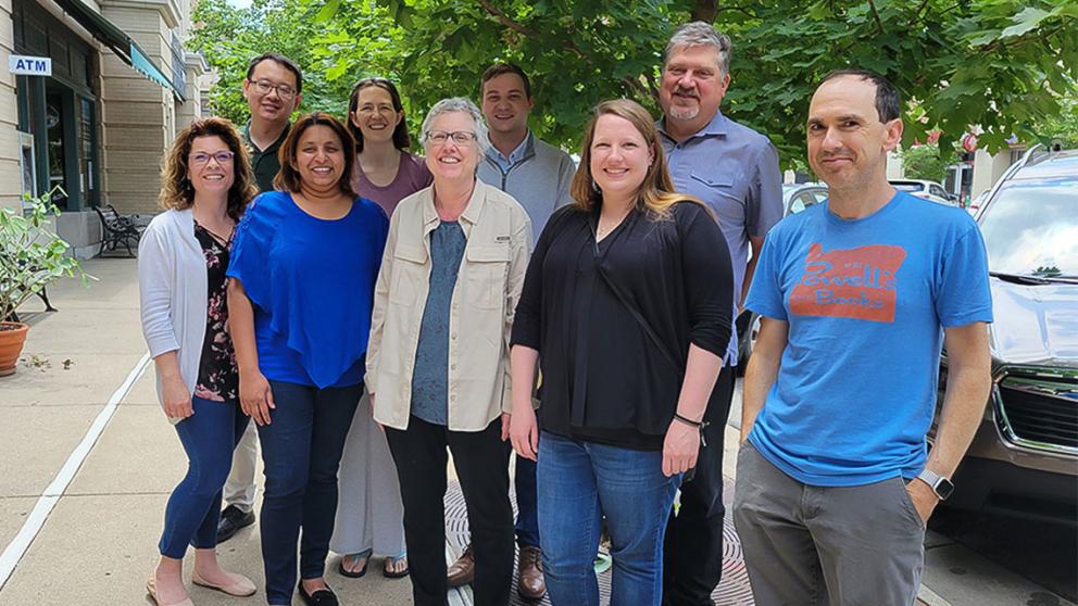 CMADP researchers and staff stand together outside on campus